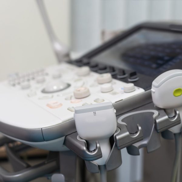 Blurry Medical ultrasound machine with 3D 4D image in a hospital diagnostic room. Modern medical
