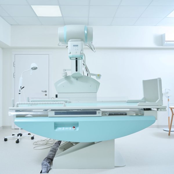 X-ray room with modern X-ray machine in clinic